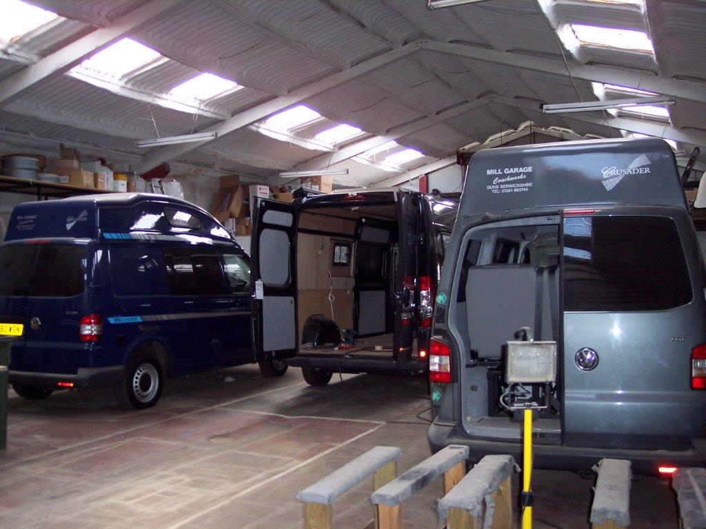 Vans in progress at Mill Garage's conversion workshop, serving the Scottish Borders and Northumberland